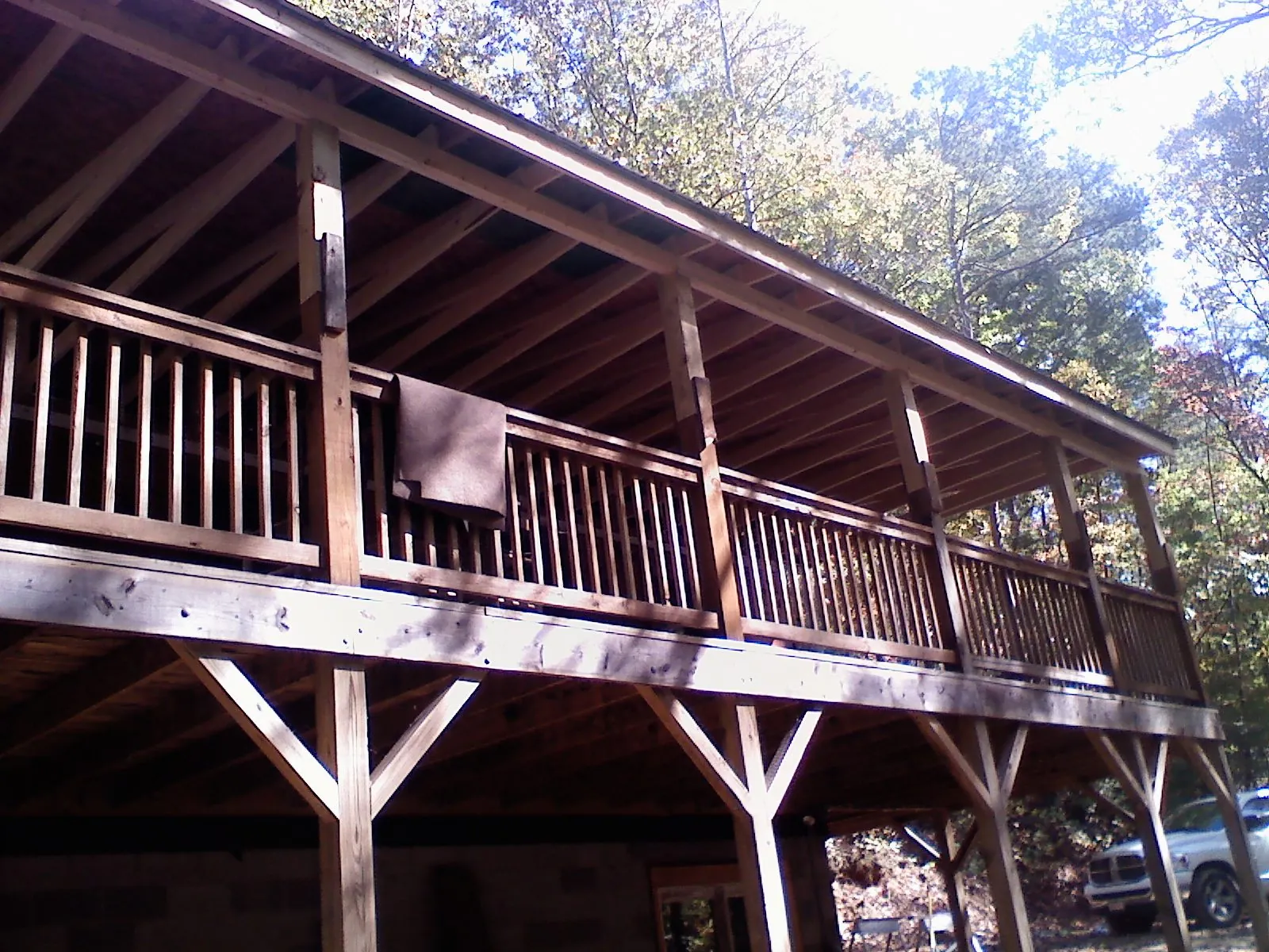 Timber framing under a new elevated porch and deck — Roof Leak Repair in Commerce City by Roofing Brothers